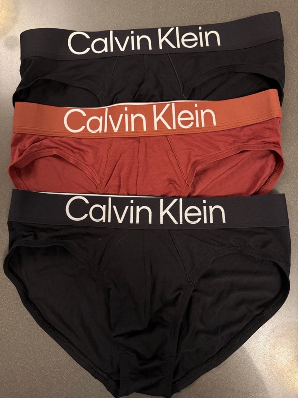 New Calvin Klein Men's Hip Briefs 3-Pack in Black and Rust.  Microfiber.